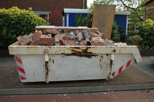 Company representative listening to a customer complaint about skip hire